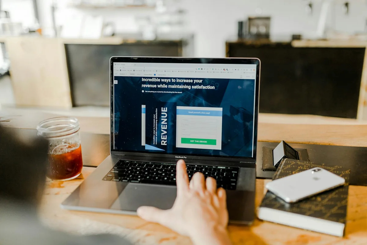 Hands typing on a laptop showing a lead capture pipeline